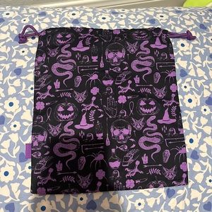 Purple and black jaw string bag perfect for a tiny bag to use around Halloween